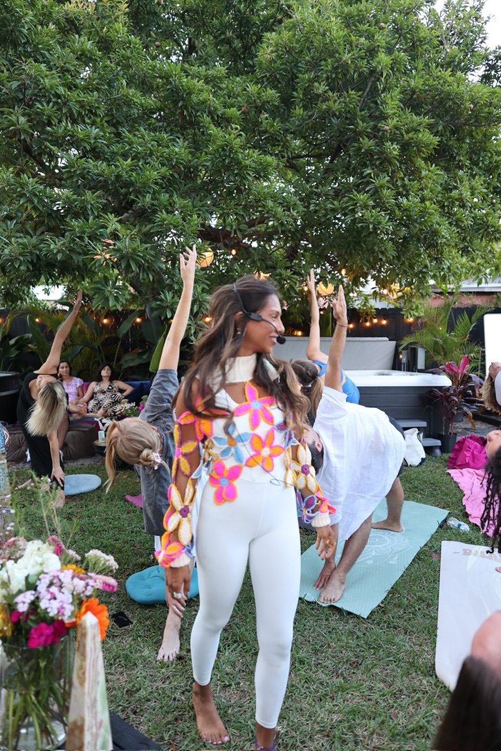 Nimi leading an outdoor yoga gathering